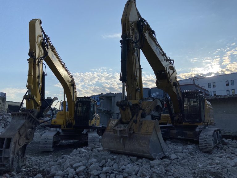 Diggers on site during exterior demolition